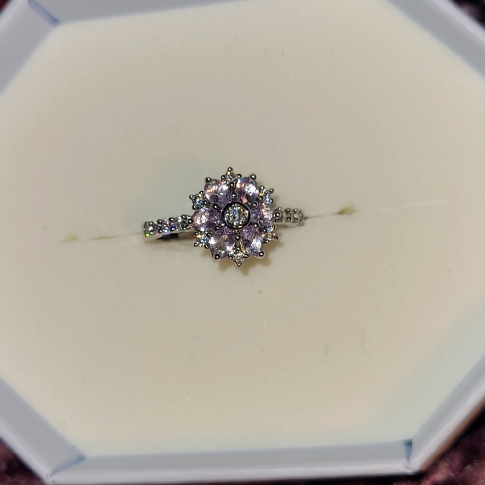 Light amethyst flower style ring. Rhodium plated. Size 9.